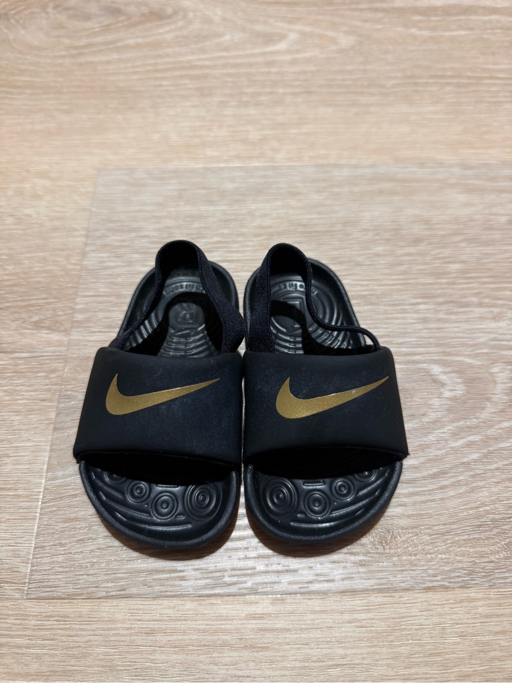 Nike Kids Black Slides with Gold Swoosh